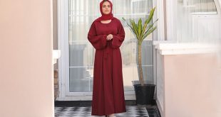 Girl is wearing Cherry maroon abaya dress