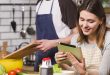 Student receiving cookery assignment help with a chef's hat and cooking tools.