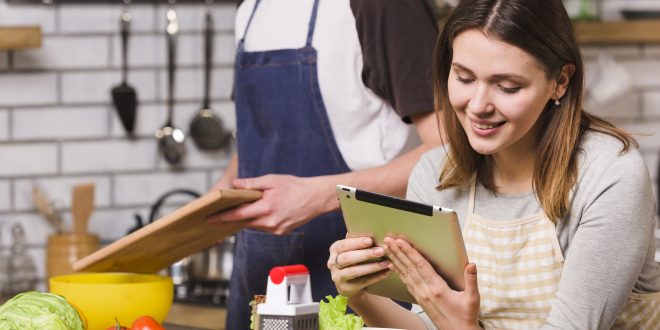 Student receiving cookery assignment help with a chef's hat and cooking tools.