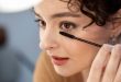 Women apply Eyeliner