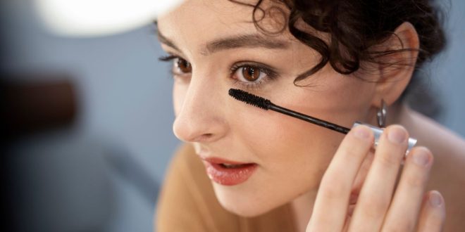 Women apply Eyeliner